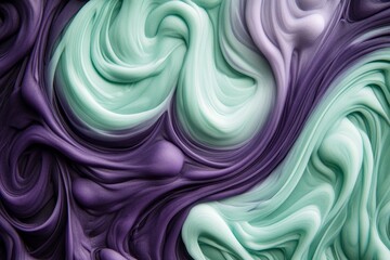 Obraz premium Close-up view of vibrant swirls of purple and mint green slime.