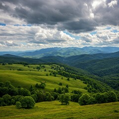 Lush green rolling hills meet forested mountains under a dramatic cloudy sky. A scenic landscape view evoking a sense of peace and grandeur.