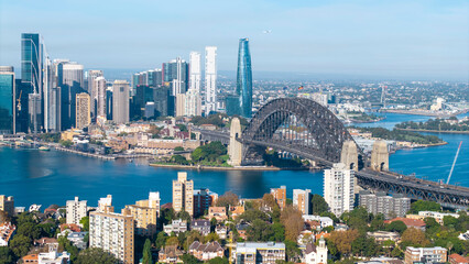 The Sydney harbor bridge and the harbor side suburb of  Kirribilli .
