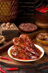 Spicy duck head is a marinated dish using traditional Chinese spices and is a popular street food.