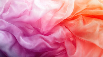 Obraz premium A pink and orange fabric with a flowy texture. The colors are vibrant and the fabric appears to be made of silk