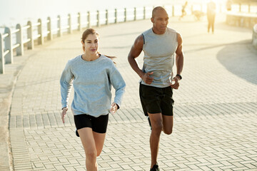 Promenade, couple and fitness with running for exercise, cardiovascular health and wellness with sports. Outdoor, man and woman with training for marathon challenge, endurance and energy by flare