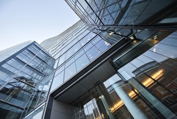 Exterior glass wall and architectural details of an office building in London, looking up at the facade