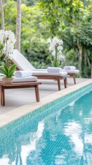 Relaxing poolside scene with comfortable loungers and lush greenery