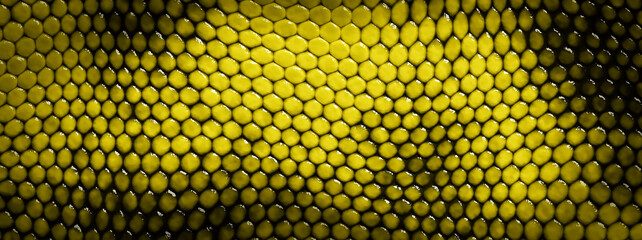 ざらざらした質感の黄色い鱗の抽象的な背景