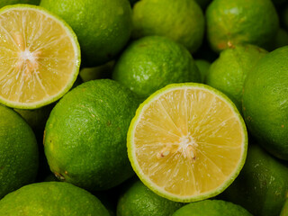 Close up of fresh lime, full frame, background, whole and half, green limes, natural, fruit