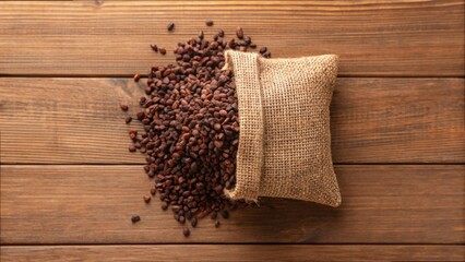Cacao Nibs Spilling from Eco-Friendly Sack on Wooden Surface
