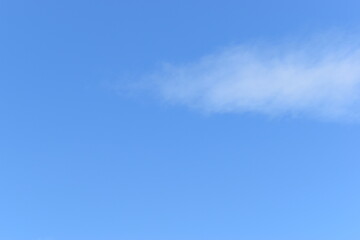 beautiful blue sky and white fluffy group of clouds with sunrise in the morning, natural background