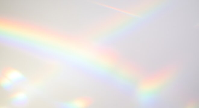 Rainbow Light Refraction on Wall Abstract Background