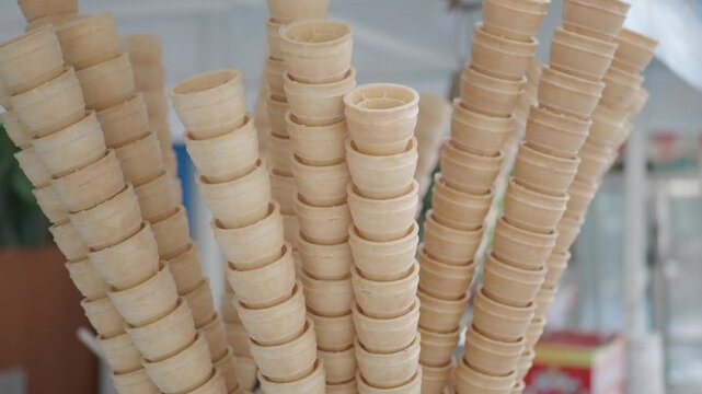 Ice cream cones stacked in a vibrant outdoor market setting