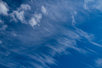 White fluffy clouds background. Blue sky with white cloud. Background of sky with clouds. Stunning sky with white clouds. Soft cloud drifting. Peaceful sky with sunlight glow.