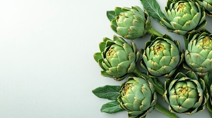 Fototapeta premium Fresh Artichokes on White Background - Culinary and Healthy Food Concept