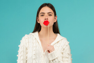 Comic woman portrait with paper lips. Funny face with lips on stick. Funny woman holding paper lips...