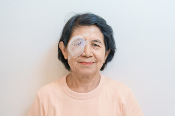 Elderly Woman with eye protective shield after eye surgery. Eye disease, Cataract,  Glaucoma, Age...
