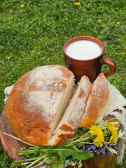 Homemade bread with milk on wooden background