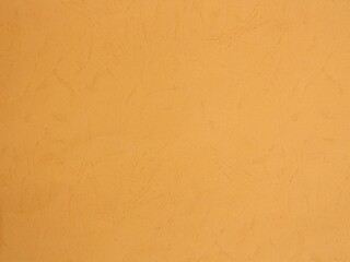 Background of textured folder paper sheet, orange color