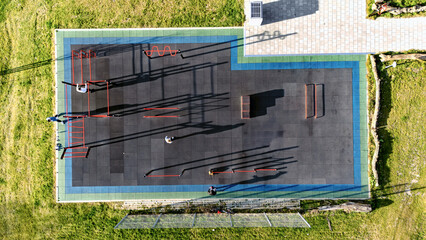 Outdoor gym for street workout aerial drone view, modern sports ground with bars and equipment for outdoor fitness and exercise, active people working out in calisthenics park outdoors
