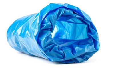 Fototapeta premium A rolled-up light blue plastic bag isolated on a pure white background showing its texture and crinkled surface.
