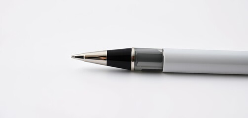 Naklejka premium Close-up of sleek black and white pen isolated on white, writing, stationery mockup