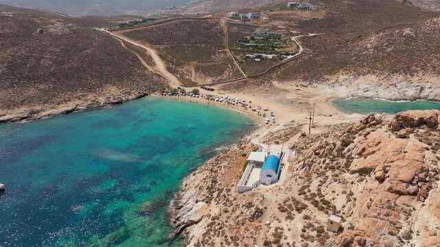Slow panning drone shot of Agios Sostis Beach of Serifos island in Cyclades, Greece