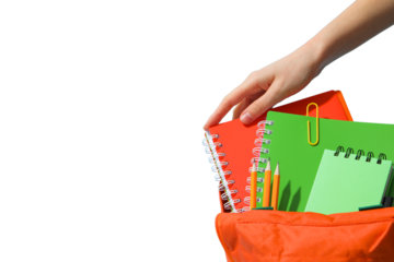 Hand reaching into a backpack filled with notebooks and stationery, isolated on white, PNG