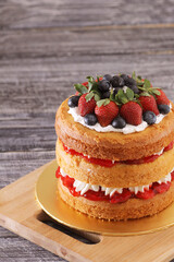 creamy naked cake with berries topping