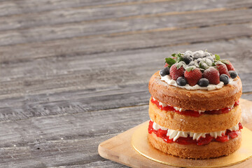 creamy naked cake with berries topping