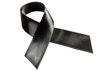 Black awareness ribbon on black background symbolizing mourning and support, cut out