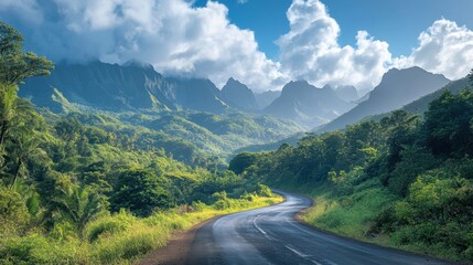 Fototapeta premium A scenic mountain road winding through lush forests, with towering peaks in the distance