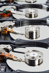 Closeup view of a harddisk array showcasing multiple disk drives and mechanical components