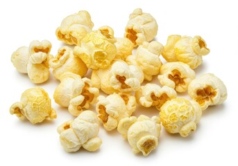 A scattered pile of freshly popped popcorn pieces on a plain white surface in a close up studio shot