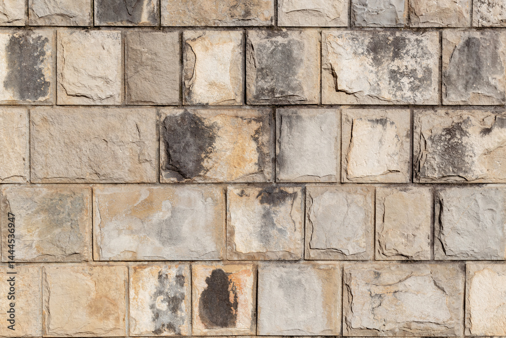 Poster sandstone and limestone tile bricks wall surface texture background. wall background. limestone tile
