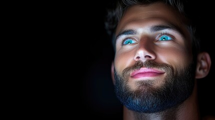 Obraz premium Close-up portrait of a man with striking turquoise eyes and a slight smile