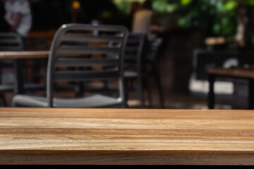 Wooden table copy space empty background mock up. table mock up with blurred cafe background. Wooden tabletop product placement Wooden countertop in restaurant with empty space Wooden table background
