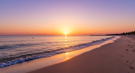 Fototapeta premium Beach Sunset with Golden Light Reflecting on the Sand and Gentle Waves