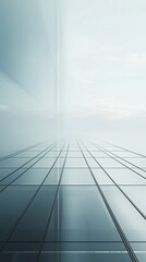 Obraz premium A modern, reflective facade with a clear sky backdrop and geometric patterns.