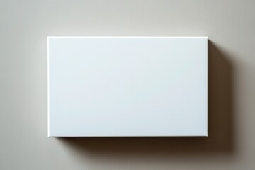 Blank canvas on a neutral wall, showcasing simplicity and potential for creativity