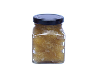 Glass jar of homemade mango jam in natural color, isolated on white background. Concept, fruit processing and food preservation,reducing food waste and extending shelf life naturally.