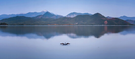 Coast of Lake Koycegiz, Mugla,Turkey. Panorama of mountain lake Koycegiz at sunset. One of the most extensive coastal lakes in Turkey.