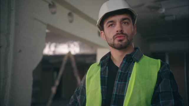 Professional Caucasian inspector architect contractor man guy technician engineer male analyzing draft blueprint builder designer labourer looking scheme inspect building in construction manufactory