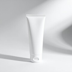 A sleek white tube with a shiny silver lid slightly ajar, revealing a smooth, creamy substance inside, set against a soft, neutral background.