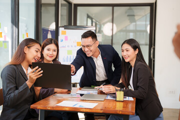 Group of business people are having a presentation meeting in an office room.