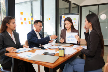 Group of business people are having a presentation meeting in an office room.