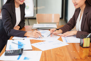 Group of Asian businessmen sitting and talking, consulting, discussing, having a meeting.