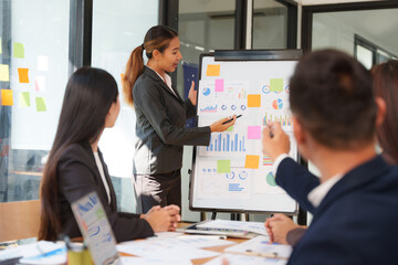 Group of Asian businessmen sitting and talking, consulting, discussing, having a meeting.