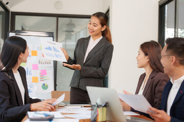 Group of Asian businessmen sitting and talking, consulting, discussing, having a meeting.