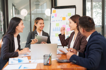 Group of business people are having a presentation meeting in an office room.