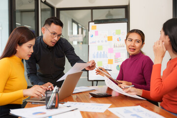 Group of business people are having a presentation meeting in an office room.