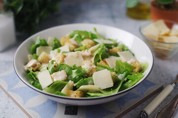 A bowl with classic Caesar salad