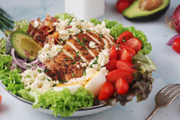 A bowl with cobb salad, traditional American dish	